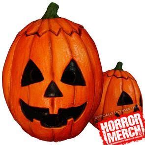 two pumpkins with faces carved into them and the words horror merch on it