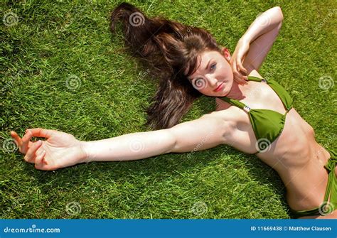 Bikini Model Lying Down On Grass Royalty Free Stock Photos Image