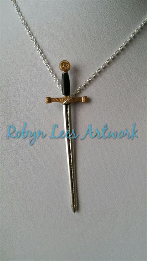 Large Silver Black And Gold Excalibur Sword Necklace On Silver Crossed