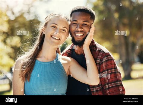 Portrait Of Interracial Couple Young People And Relax In Park Sunshine And Summer For Love