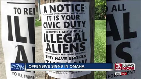 Signs Urge Reporting Of Illegal Aliens To Ice