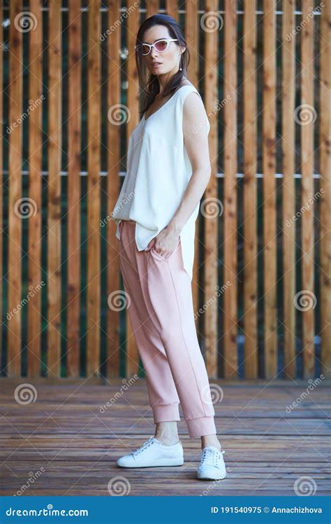 Woman In Pink Pants On Wooden Terrace Stock Image Image Of Model