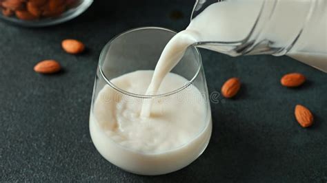 Pouring Almond Milk In Glass Vegan Milk Plant Based Milk Replacer And