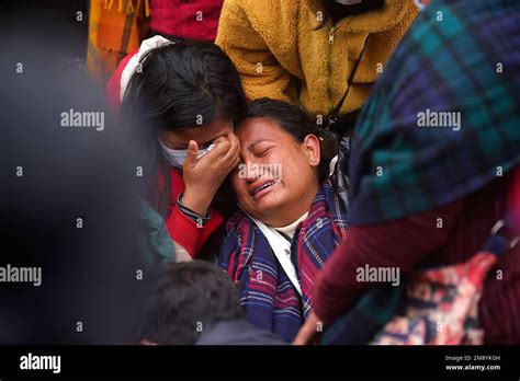 A Woman Wails As She Waits To Receive The Body Of A Relative Victim Of