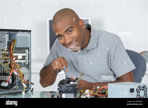 Man Fixing A Motherboard Stock Photo Alamy