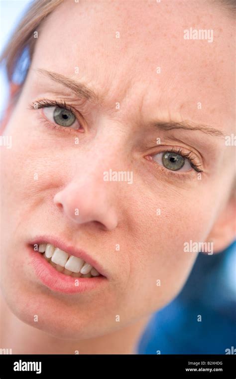 Head Shot Of Woman Scowling Stock Photo Alamy