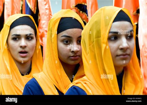 Young Sikh Women In Temple Or Gurdwara During Festival Of Vaisakhi