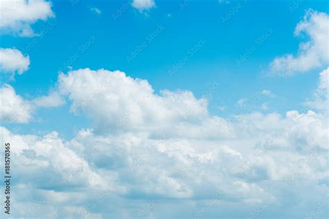 clear blue sky  plain white cloud  space  text background