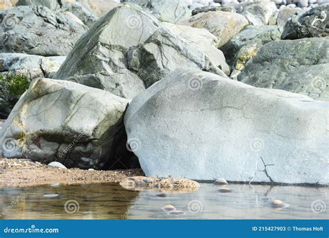 Large Stone Boulder Formation with Reflections in Water Stock Image ...