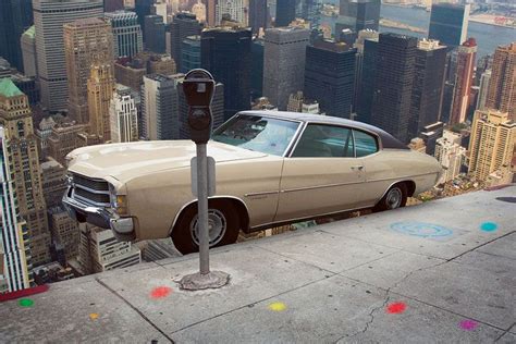 An Old Car Parked On Top Of A Parking Meter In Front Of A Cityscape