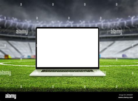 Laptop mockup on football field. Stadium stands in background. Isolated ...