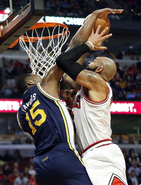 Chicago Bulls Forward Carlos Boozer Right Goes To The Basket Against