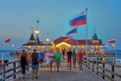 Pier Ahlbeck On The Baltic Sea With National Flags In The Wind