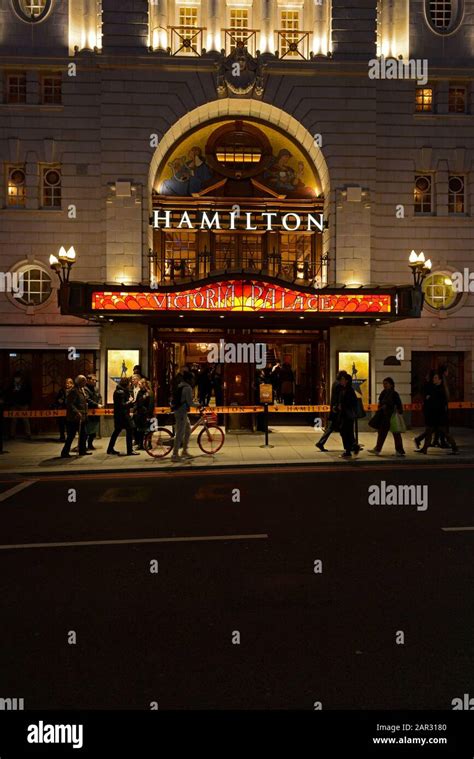 The main entrance to Victoria Palace Theatre at night with Hamilton the musical playing. London ...