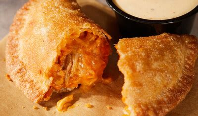 Taco Bell Unveils The Cheesy Chicken Crispanada A Bold Innovation