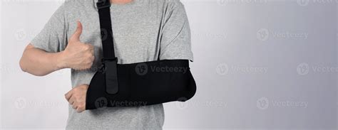 Broken arm. Arm Sling therapy support and covered around elbow first ...