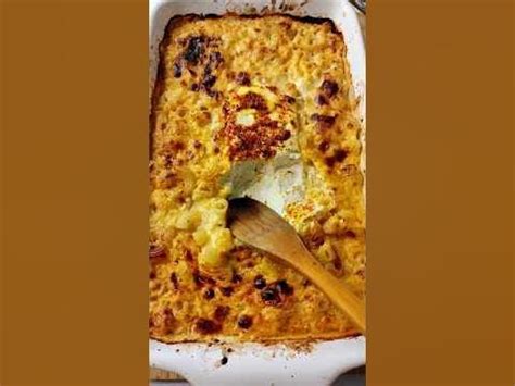 A Casserole Dish Is Shown With A Wooden Spoon