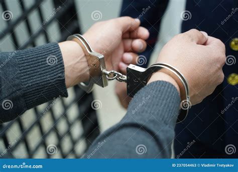 A Police Officer Handcuffs A Suspect Stock Image Image Of Control