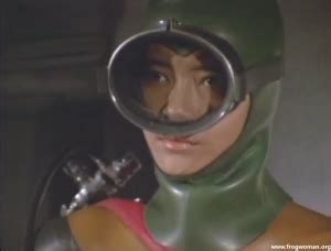 A Japanese Frogwoman In A Rubber Wetsuit And The Rubber Monster