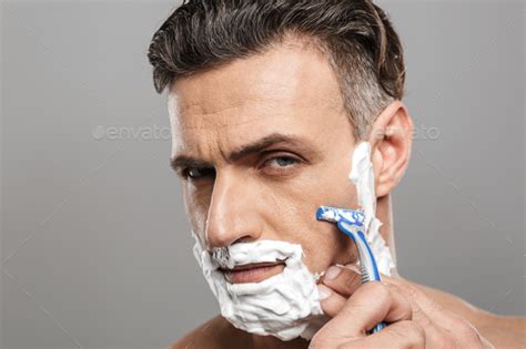 Handsome Mature Concentrated Man Naked Shaving Stock Photo By Vadymvdrobot