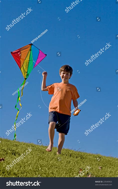 Boy Flying A Kite Stock Photo 23540953 Shutterstock