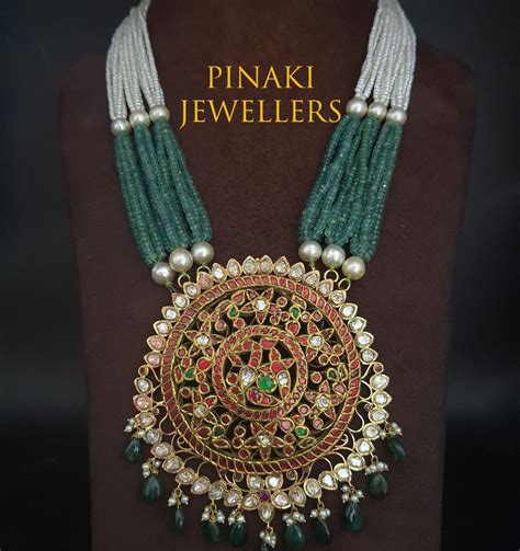 Multi Strand Pearl And Emerald Beads Necklace With Kundan Pendant