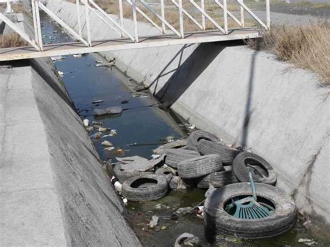 Invaden Dren Con Llantas Y Basura