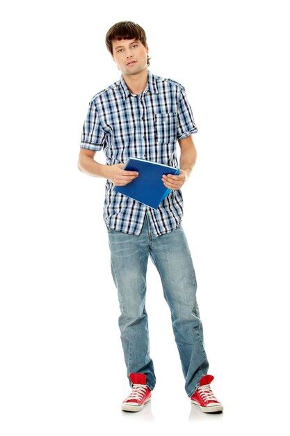 Premium Photo | Portrait of man holding book standing against white ...