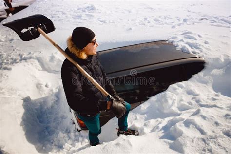 Man Cleans Snow And Cleans Car Shovel From Snow Stock Photo Image Of