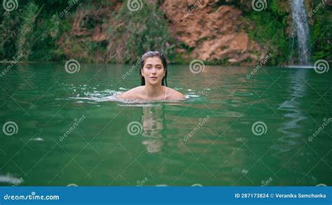 Naked Model Swimming Cliff Lake In Beautiful Summer Nature Woman