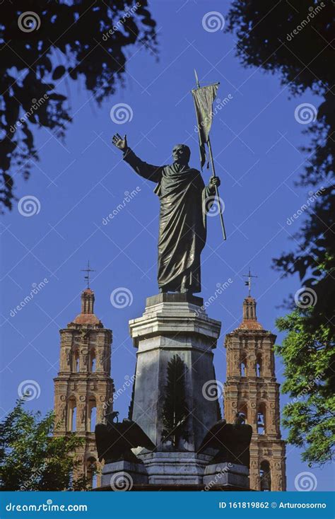 The Statue of Father Miguel Hidalgo, Framed by Vegetation and the ...