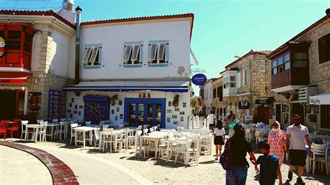 A Guide To Alacati Turkey A Hidden Gem In White With Flowers