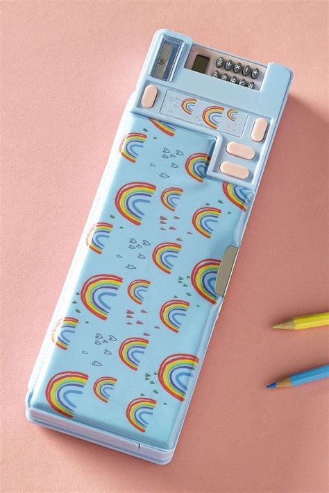 A Blue Case With Rainbows On It Next To Two Pencils