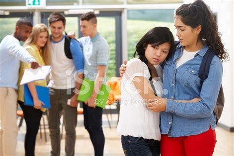 Friend Comforting Victim Of Bullying At School Stock Photo Royalty