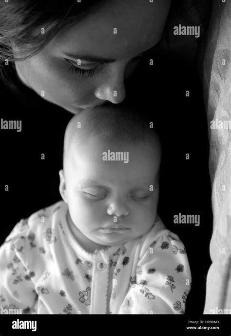 Mother Kissing Sleeping Baby Hi Res Stock Photography And Images Alamy