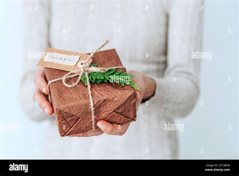 Female Hands Holding T Handcrafted Box Thoughtfully Wrapped In Eco