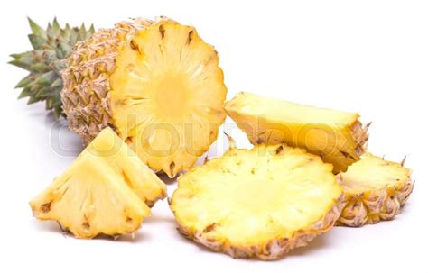 Ripe pineapple with slices and chunks ... | Stock image | Colourbox