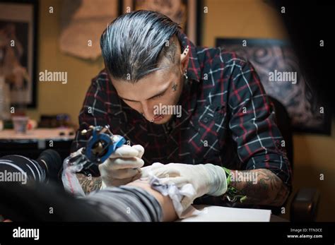 Tattooing By Hand Hi Res Stock Photography And Images Alamy