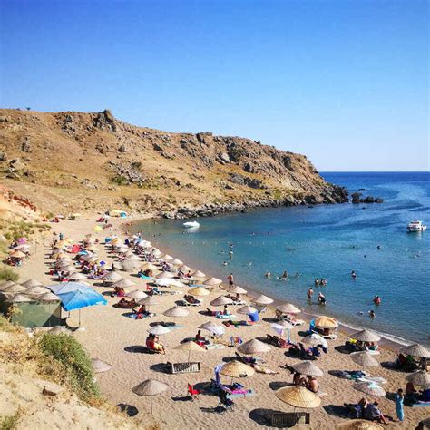 Tourists Enjoying A Peaceful Day At The Beach In Gökçeada A Turkish