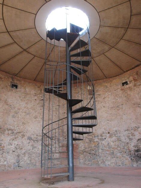 Premium Photo Spiral Staircase In Old Building