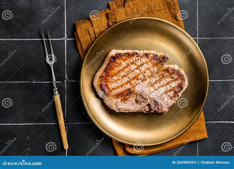 Bbq Fried Pork T Bone Chop Meat Steak On A Plate Black Background