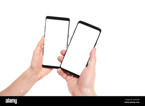 Two Hands Holding Smartphones Blank Screen With Modern Frameless Design