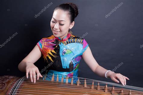 Girl playing Chinese zither Stock Photo by ©wxin67 20864529