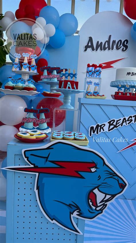 An Ice Cream Stand With Balloons And Cakes