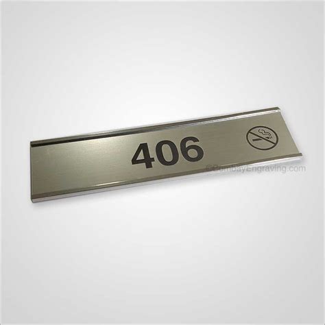 Hotel room number signs engraved with No Smoking Sign