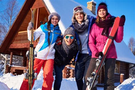 Best Friends Spend Winter Holidays At Mountain Cottage Stock Photo