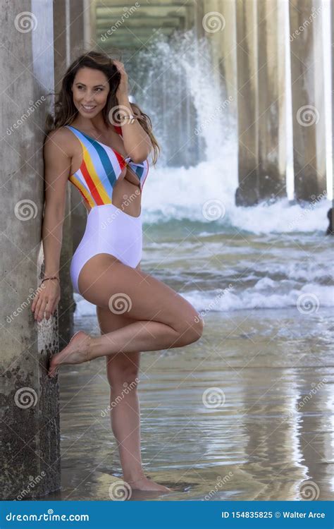 Lovely Brunette Bikini Model Poses Under The Pier Stock Image Image