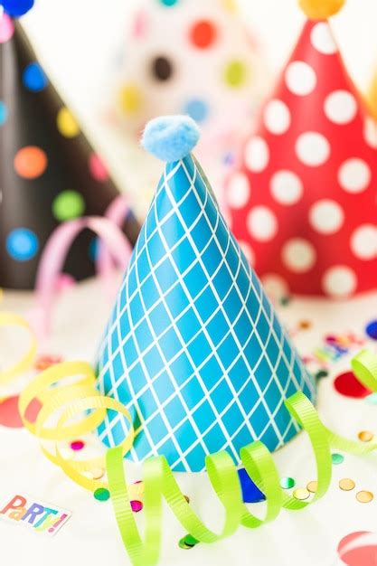 Premium Photo | Colorful party hats for kids birthday party.