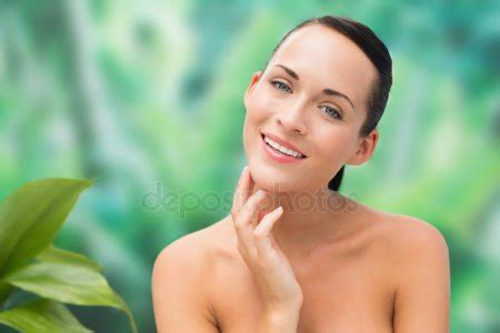 Beautiful Nude Brunette Posing With Green Leaves Stock Photo