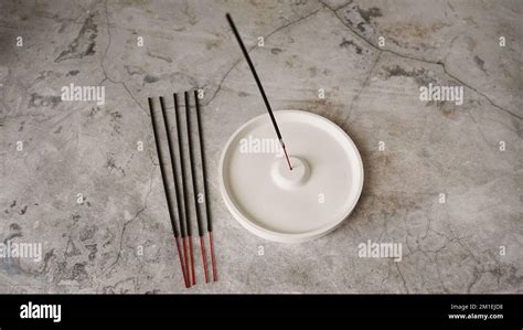 Incense Stick In Porcelain Craft Ceramic Holder On Marble Table Aroma